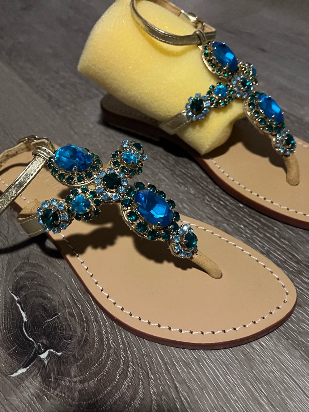 Mystique Boutique Gold T-Strap Sandals with Bright Blue Jewels